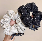 Add a playful and stylish touch to your hair accessories collection with Bowknot Hair Scrunchies. 