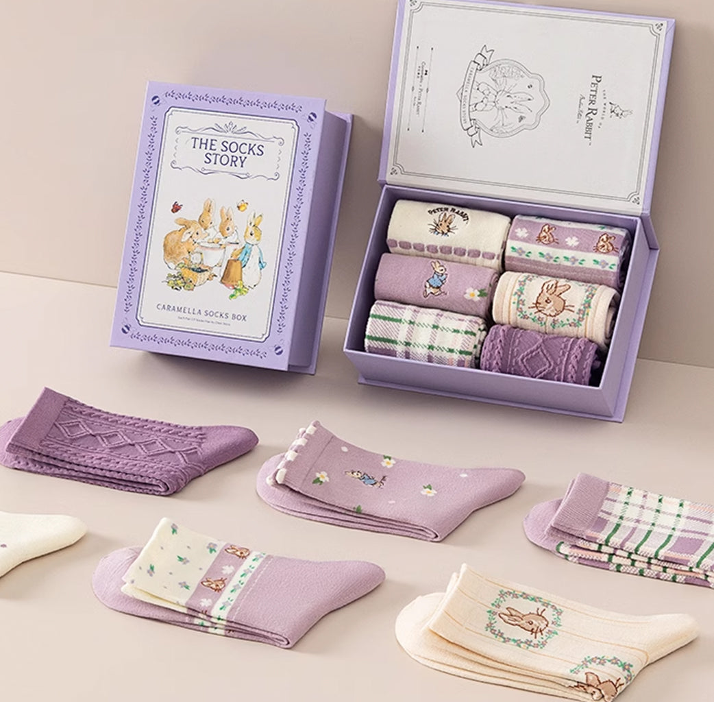 Step into the whimsical world of Peter Rabbit with this set of six uniquely designed socks.