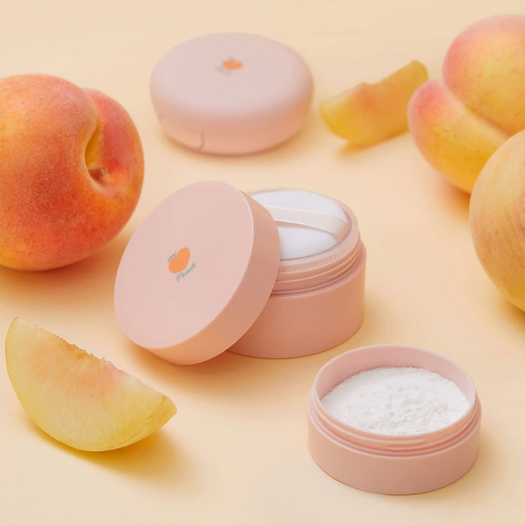 Ultra-fine finishing powder with peach extract and calamine for a matte finish, suitable for oily and acne-prone skin, with a refreshing peach scent.