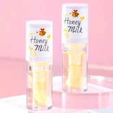 Lip oil infused with nourishing and moisturizing ingredients, including honey and milk to promote supple and resilient lips. Honey.